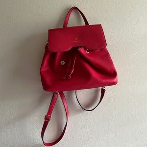 Nanette Lepore red drawstring faux leather backpack bag.